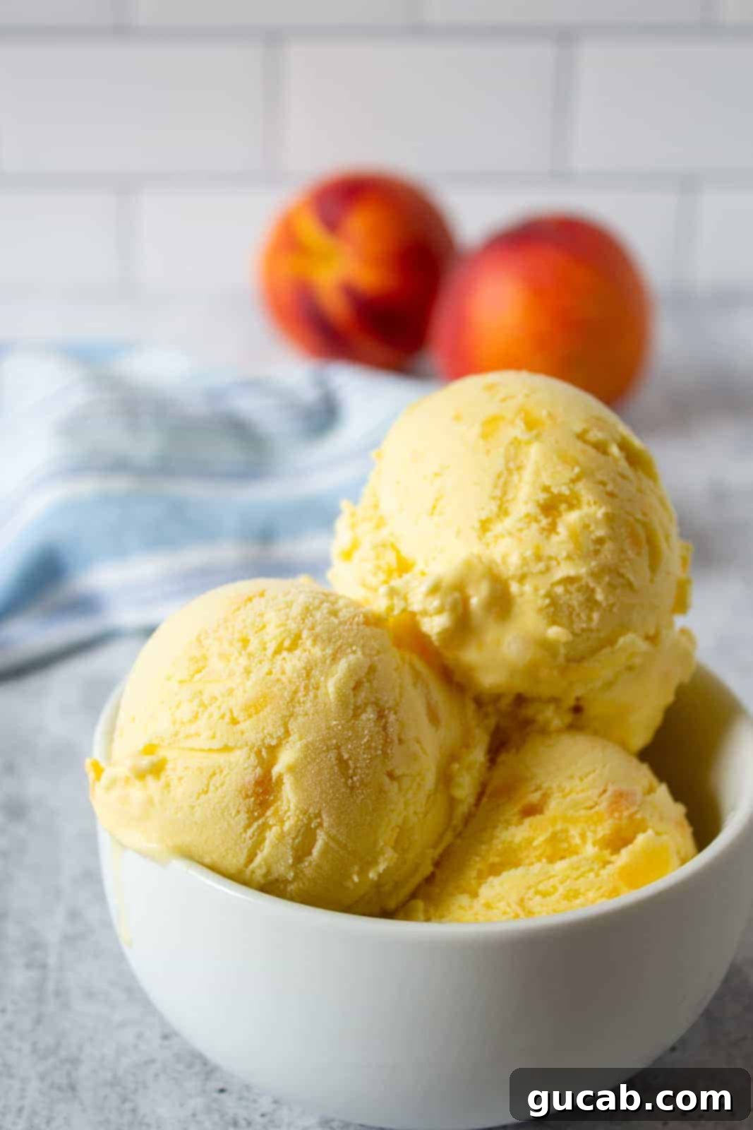 21 Must-Try Cuisinart Ice Cream Maker Recipes 5 a triple scoop of peach ice cream