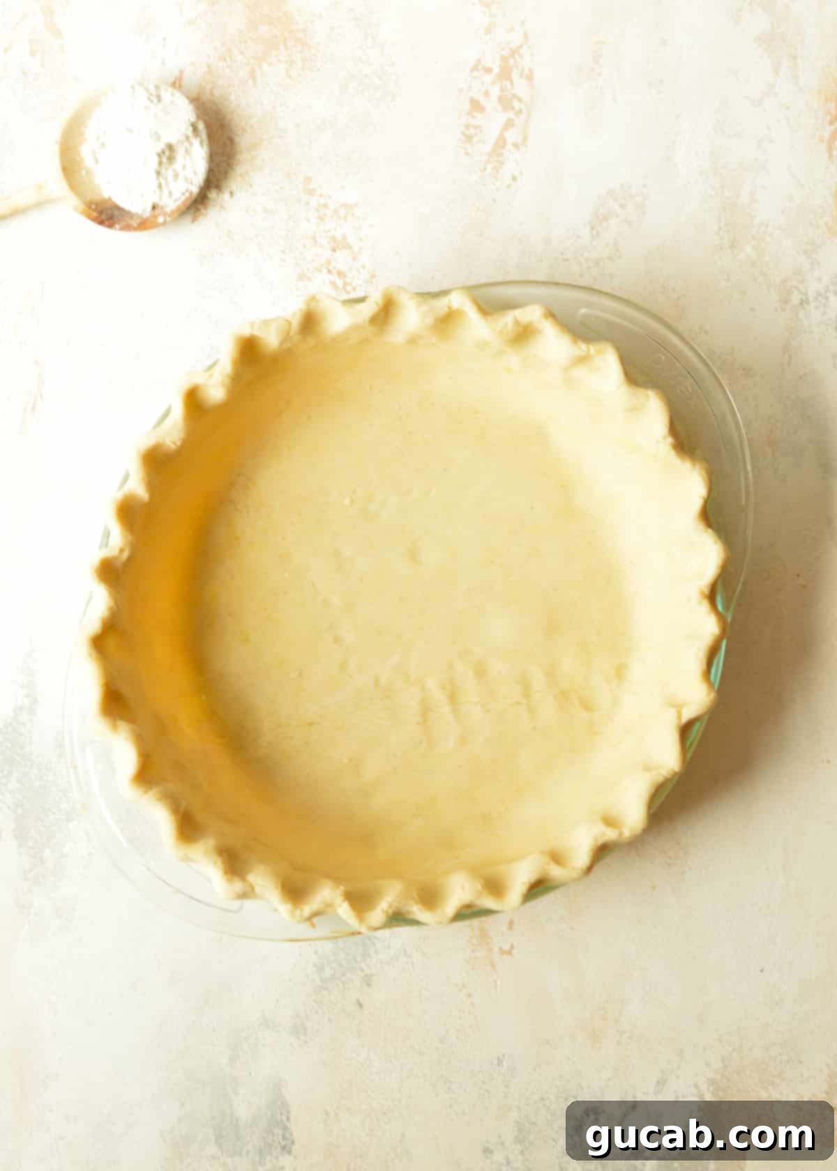 A perfectly baked, golden-brown gluten free pie crust, ready for filling.