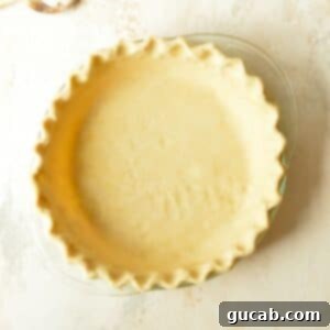 A perfectly baked, golden-brown gluten free pie crust, ready for filling.