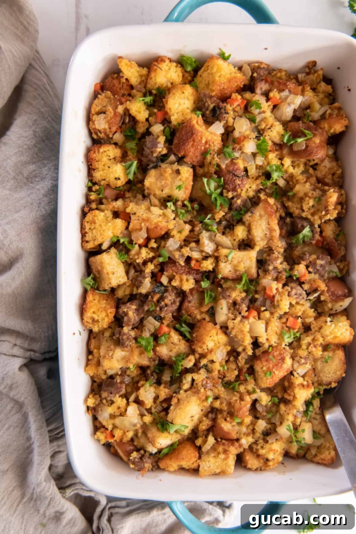 a baking dish brimming with golden cornbread stuffing