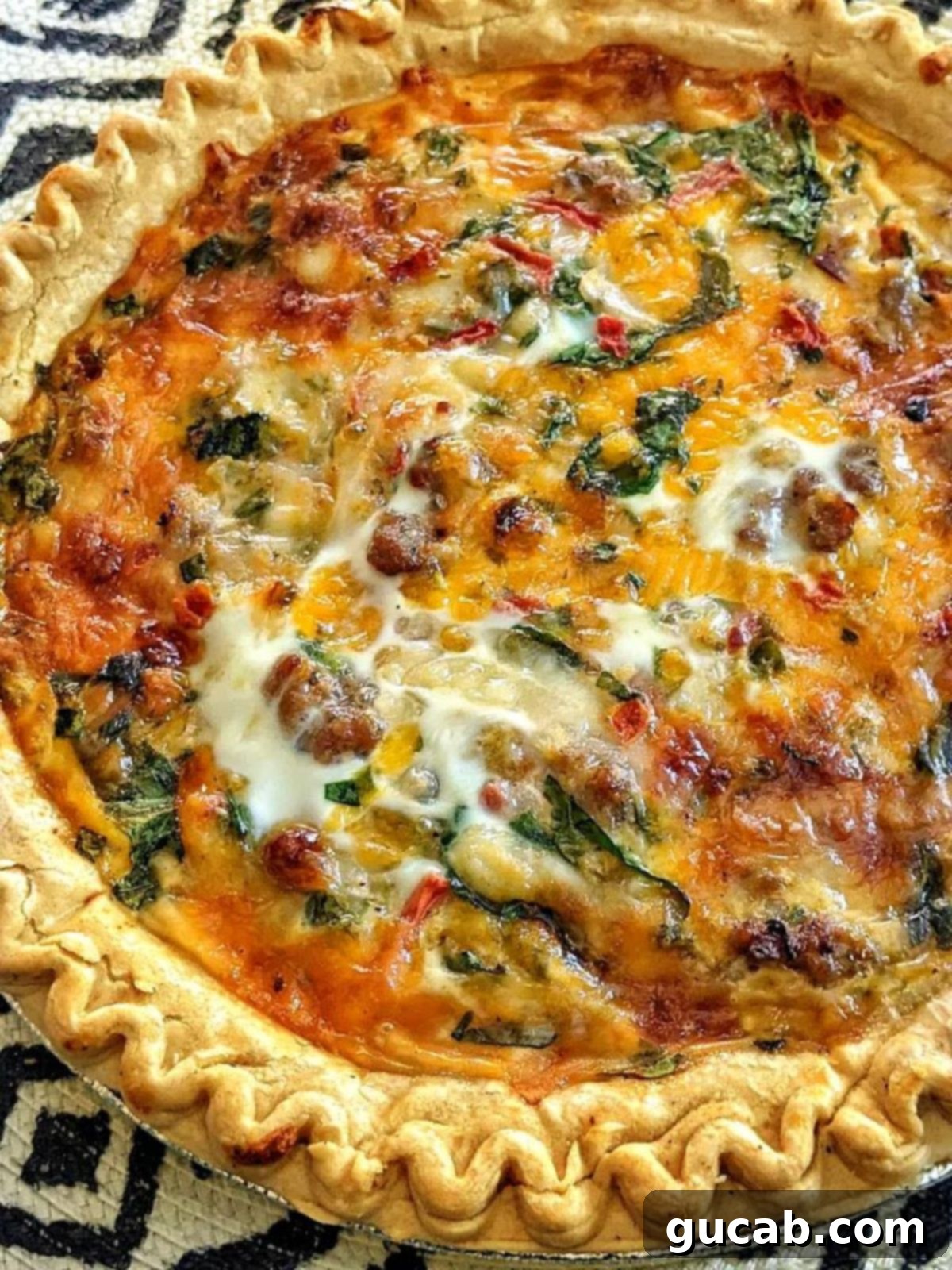 35 Incredible Ground Sausage Creations 23 A slice of savory sausage and cheese quiche, perfectly baked