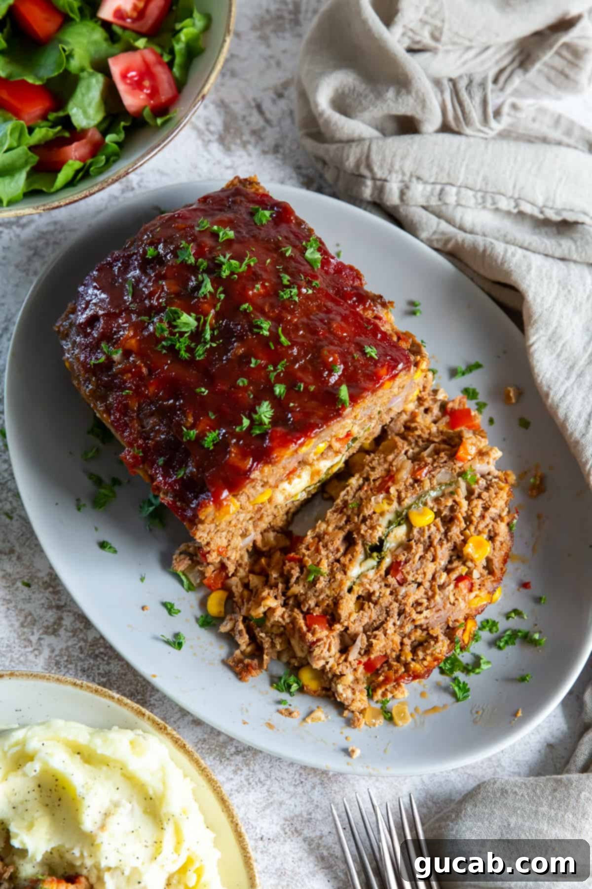 a perfectly sliced Italian stuffed meatloaf on a plate