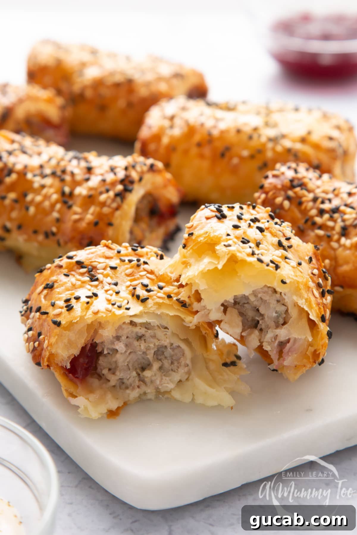 festive sausage rolls topped with sesame seeds