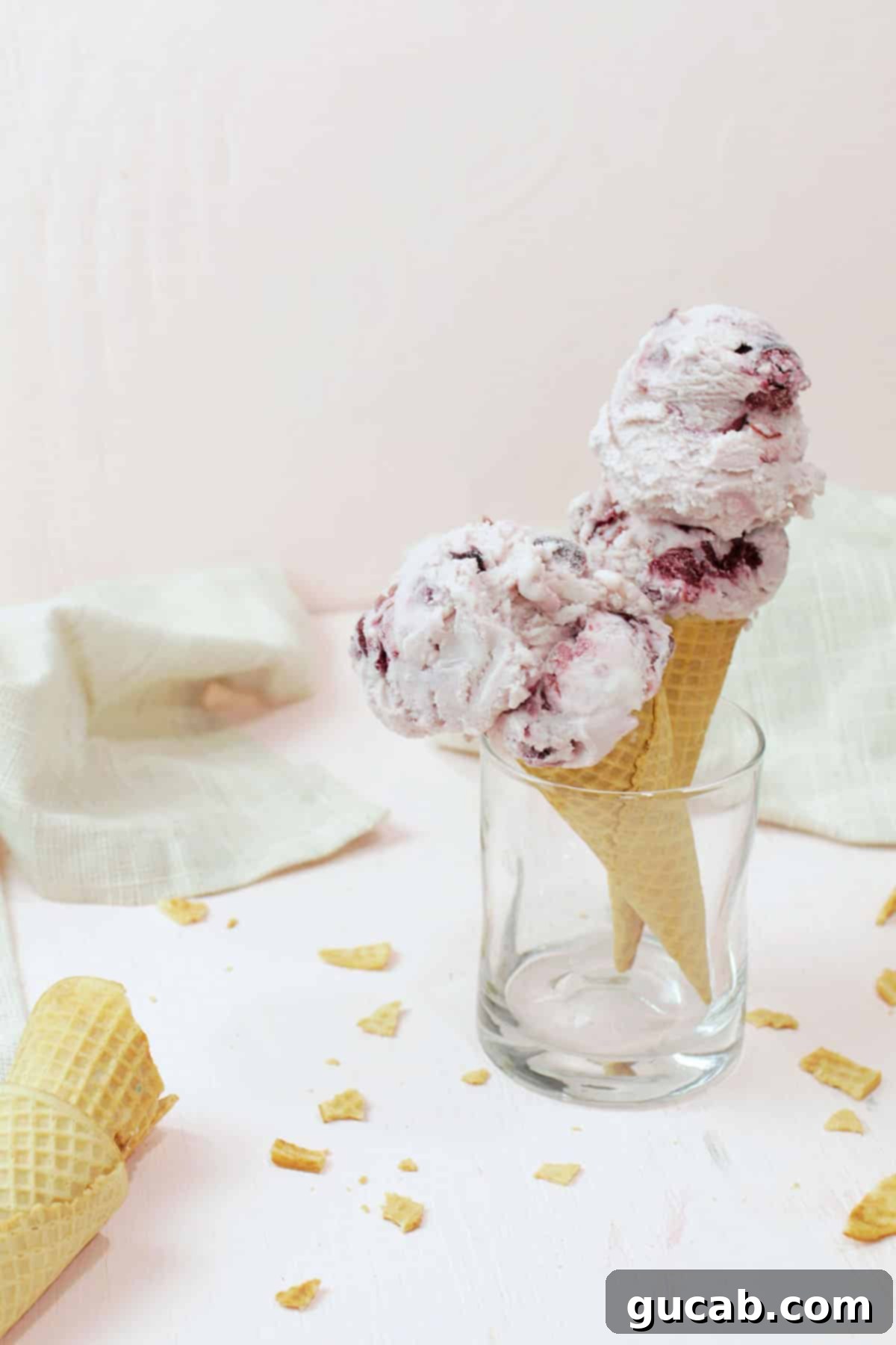 Beyond the Bowl: Creative Frozen Cherry Recipes 7 two cones with black cherry ice cream on them