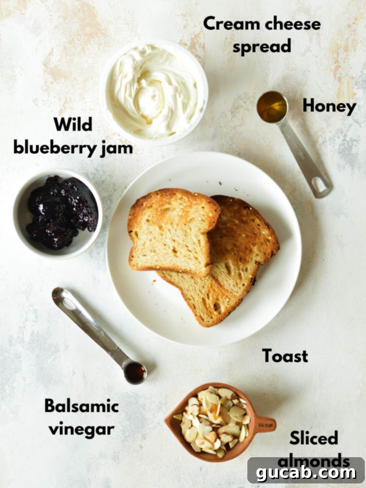 cream cheese, honey, blueberry jam, toast, honey, and almonds