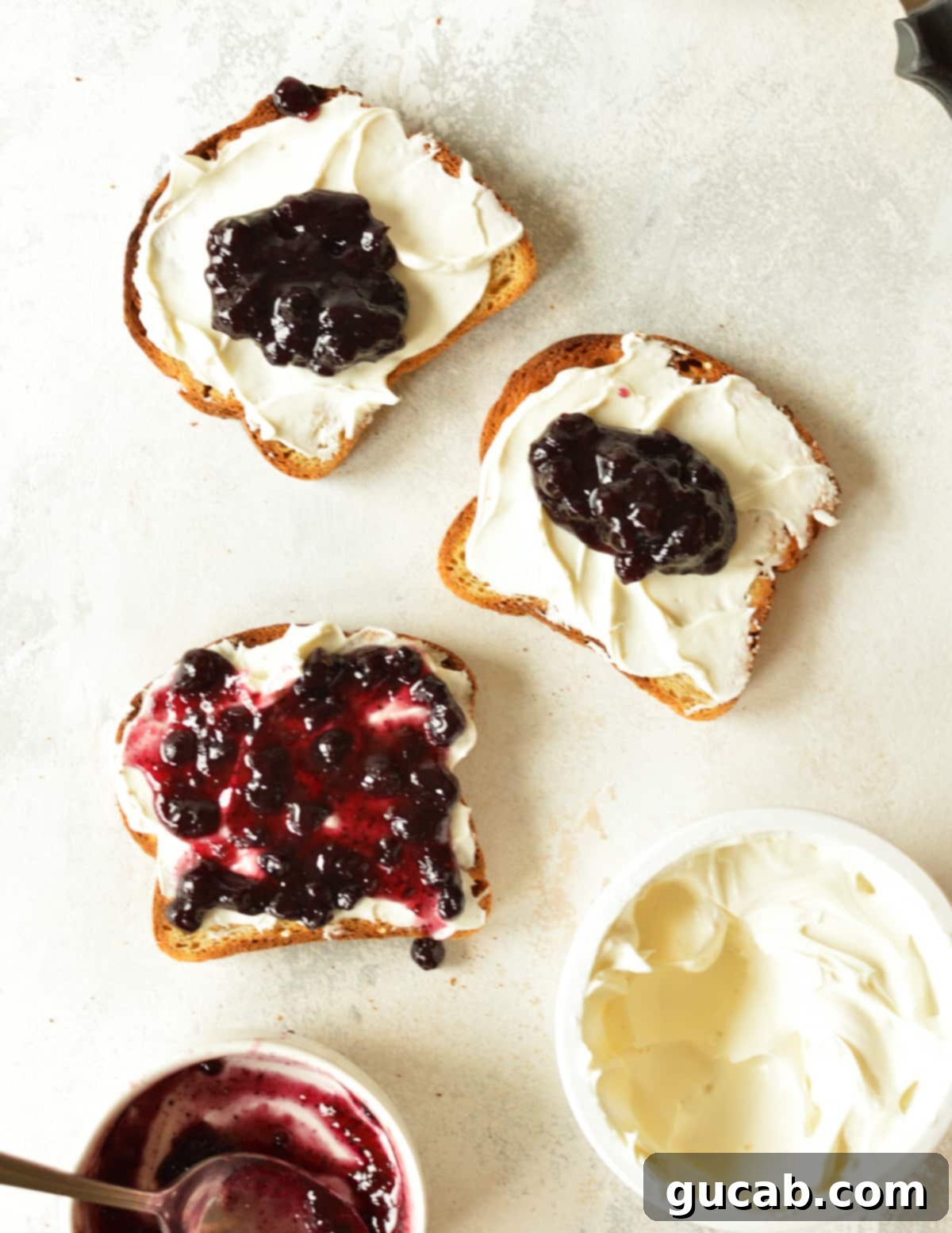 cream cheese and blueberry jam on toast