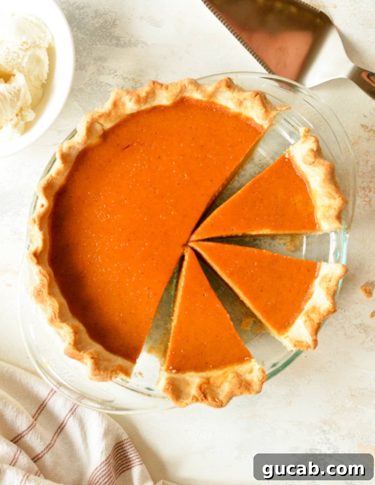 Classic pumpkin pie without evaporated milk, perfectly sliced and ready to serve for the holidays.