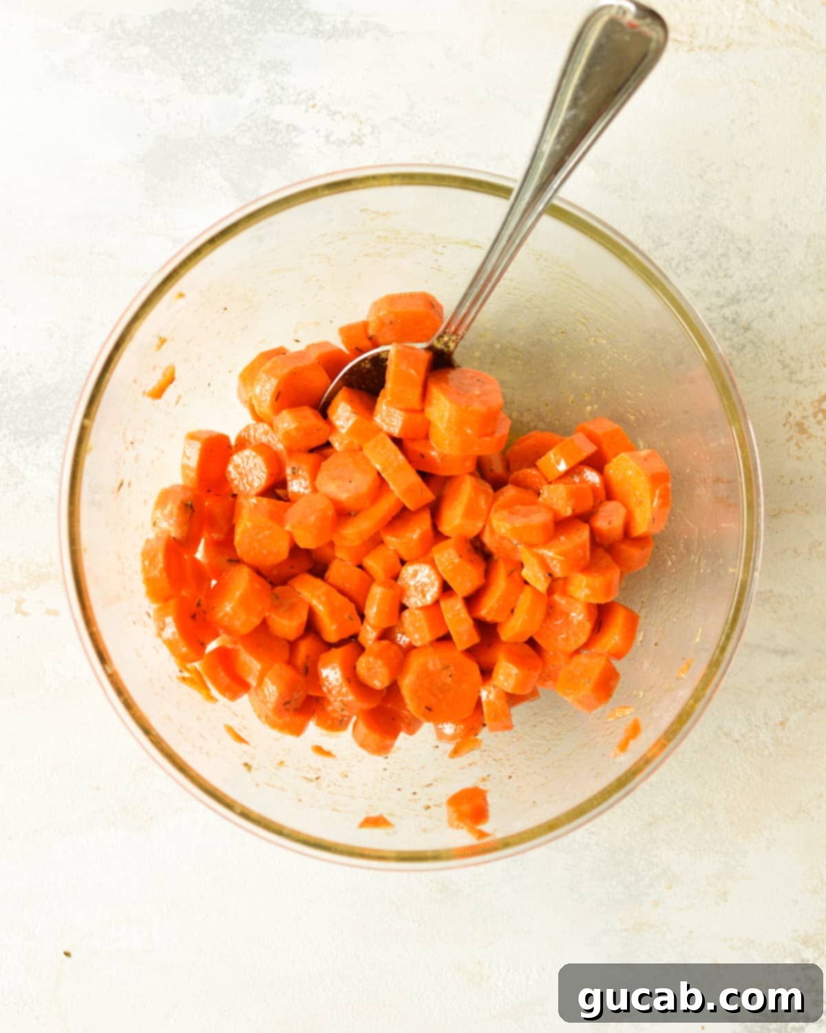 a bowl of carrots in a marinade