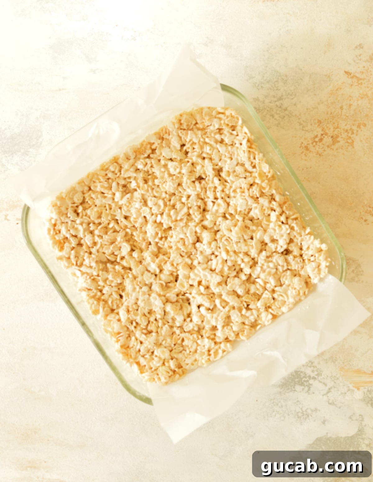 a glass dish of rice krispie treats