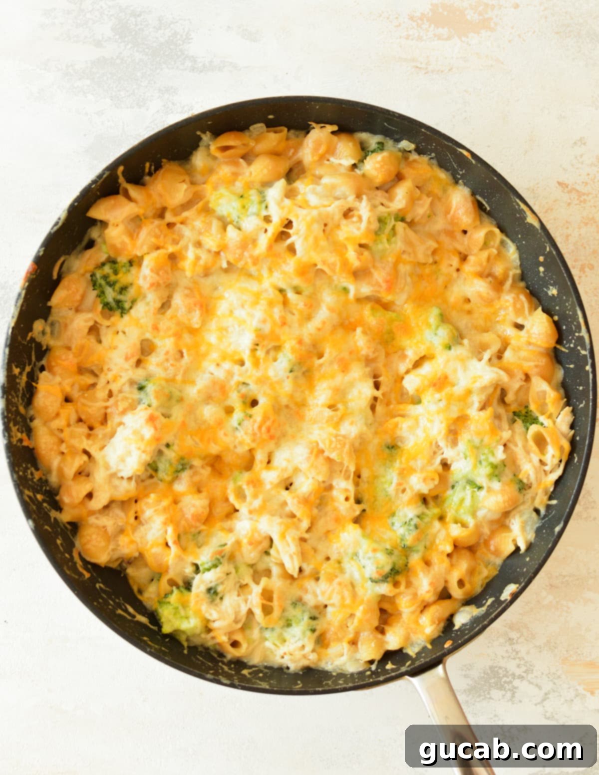 chicken broccoli and pasta casserole in a skillet