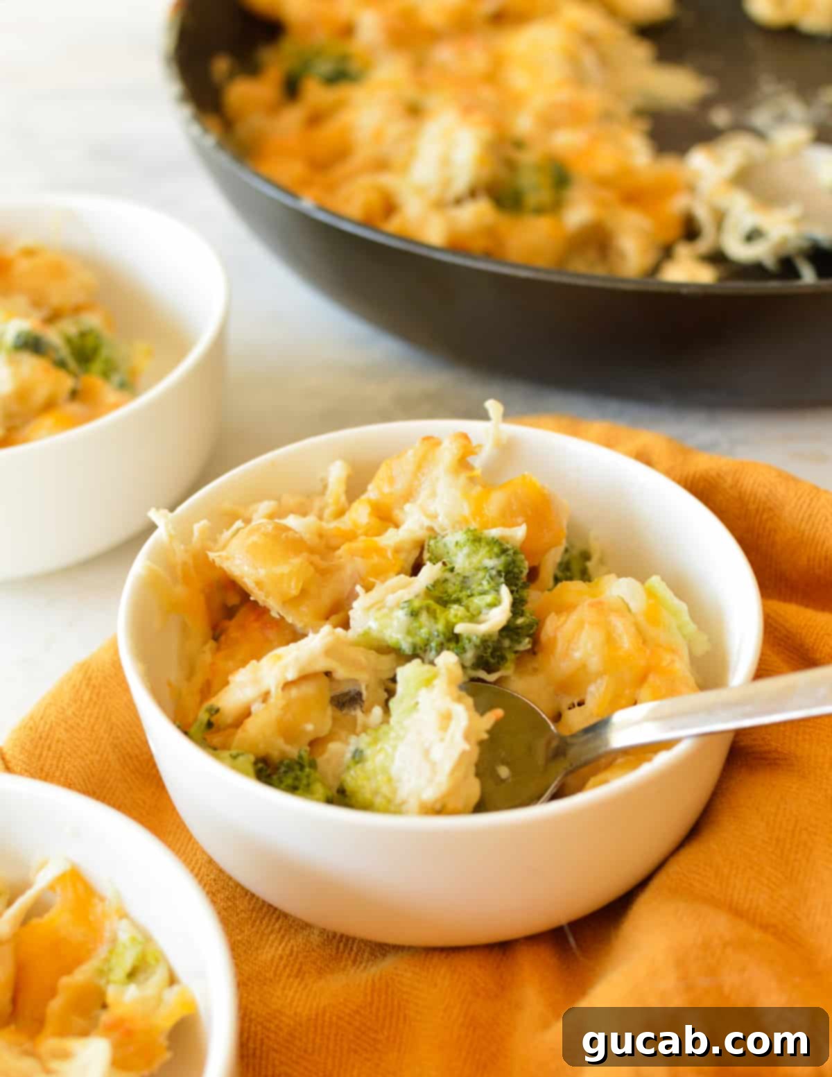 a bowl of chicken, broccoli, and cheesy pasta