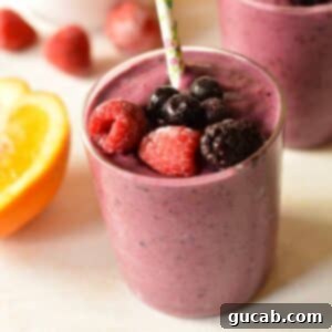 a berry smoothie with berries on it