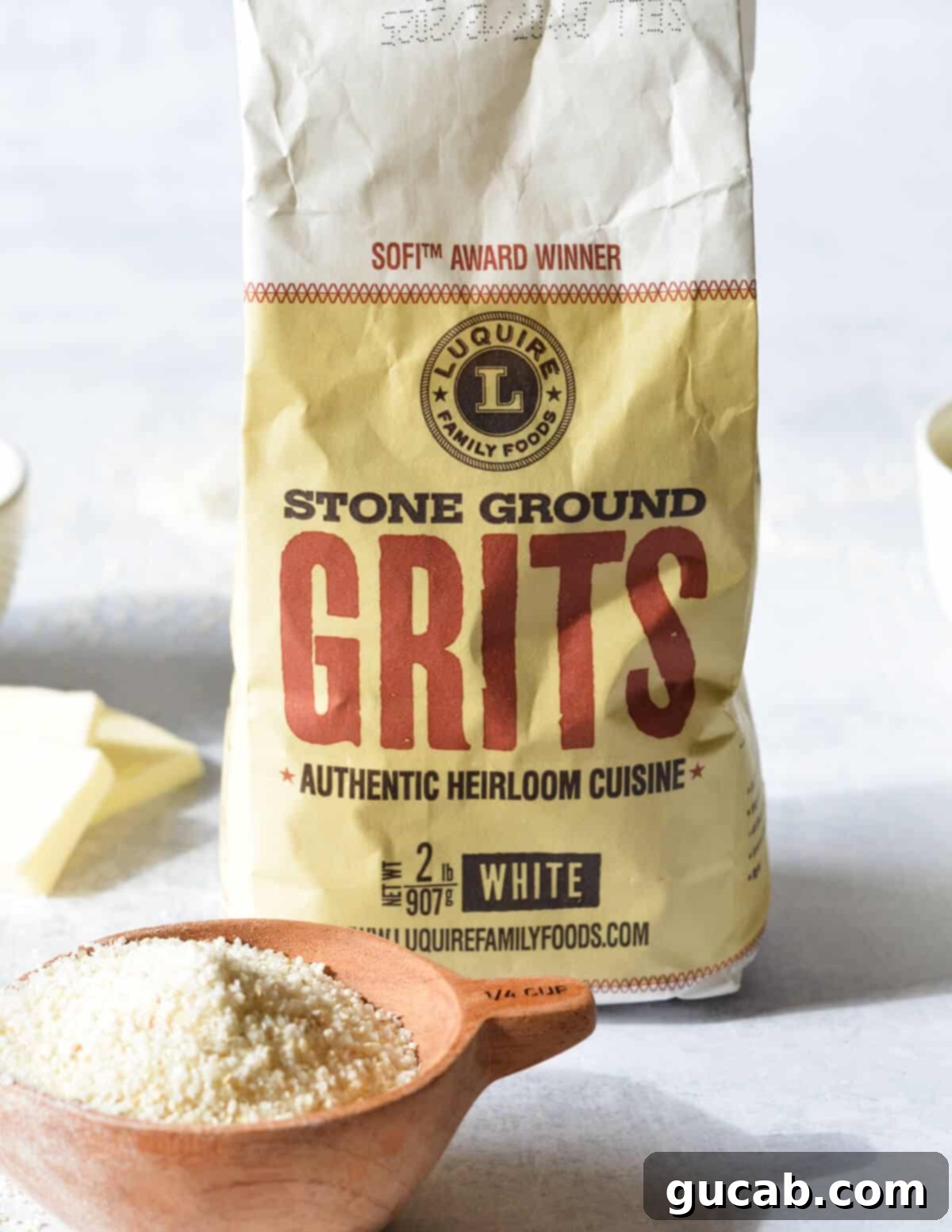 Hearty Creamy Grits 8 A close-up shot of a bag of stoneground grits, emphasizing the quality and type of grits used in the recipe.