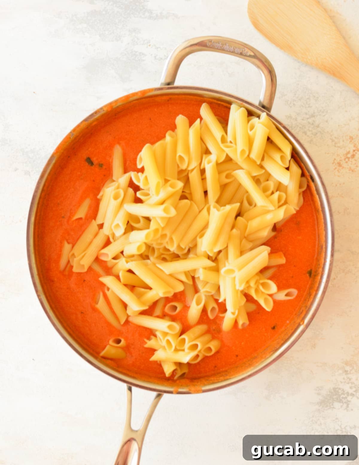 Rose Pasta 8 The pink sauce, now creamy with heavy cream and Parmesan, ready to be combined with pasta.