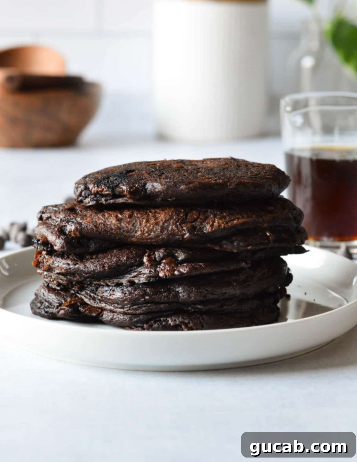 Guilt-Free Chocolate Pancake Indulgence 12 A perfectly cooked stack of gluten-free chocolate pancakes, ready to be served.