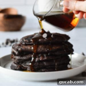 Guilt-Free Chocolate Pancake Indulgence 13 a stack of gluten free chocolate pancakes, enticingly layered and ready to eat.