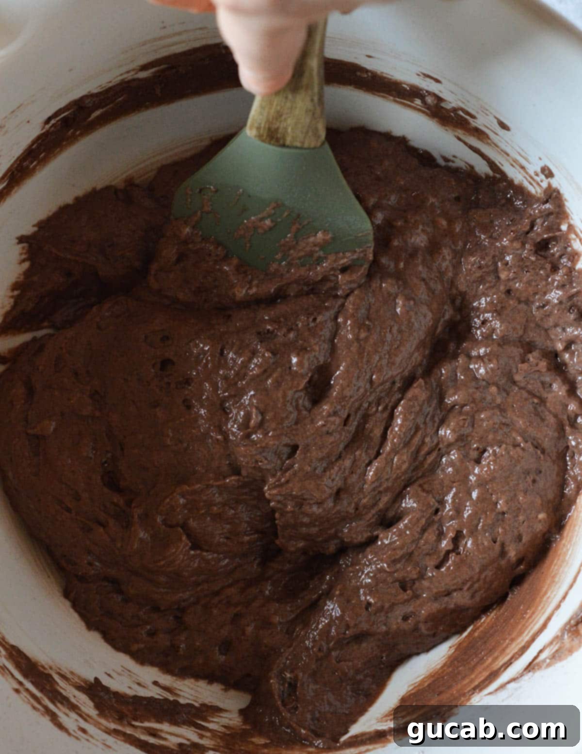 Guilt-Free Chocolate Pancake Indulgence 7 A bowl filled with smooth, dark gluten-free chocolate pancake batter, showing its readiness for cooking.