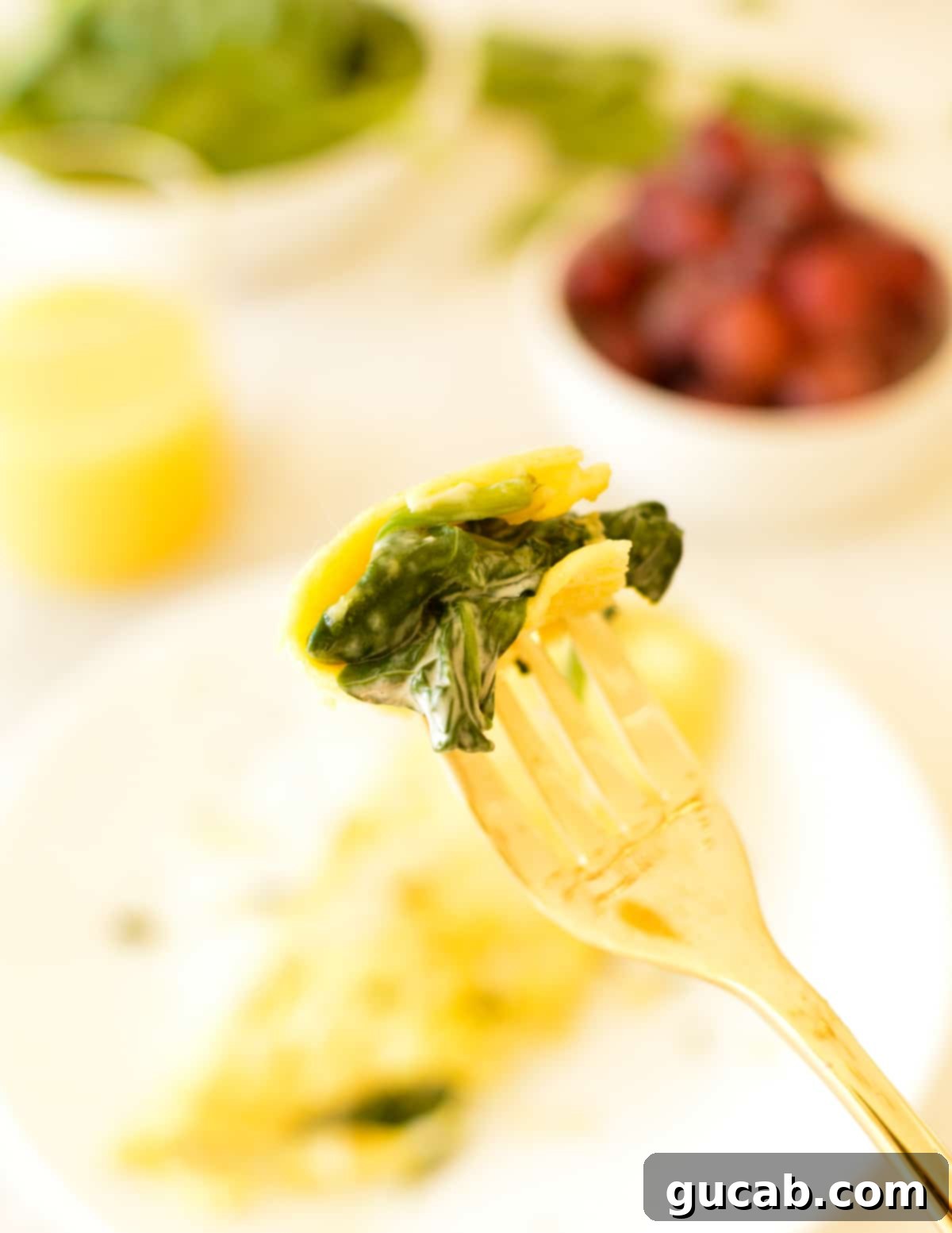 bite of a spinach omelet on a fork