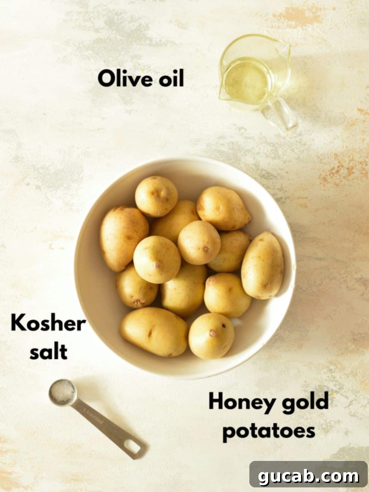 Ingredients laid out for roasting honey gold potatoes.