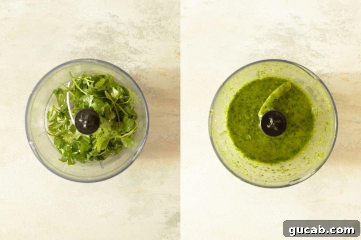 Fresh cilantro and ingredients being blended in a food processor for the vinaigrette.