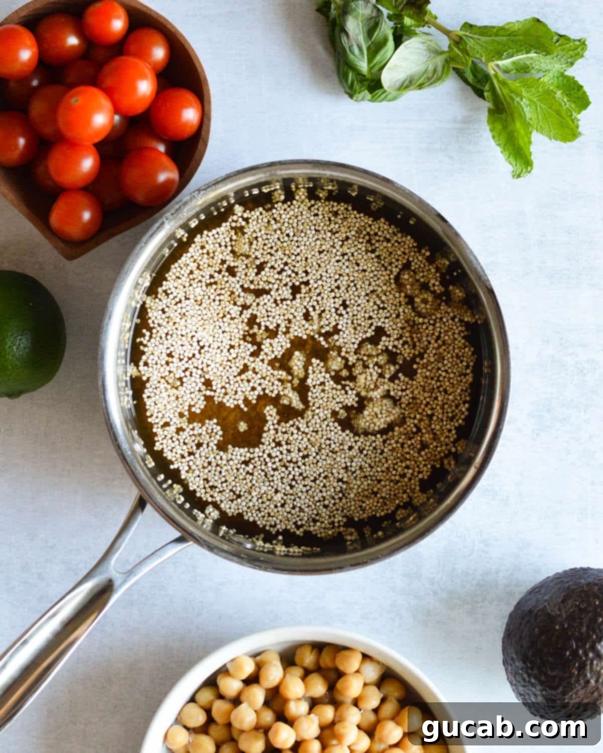 Vibrant Herb & Quinoa Power Bowl 4 a small saucepan with quinoa and vegetable stock in it.