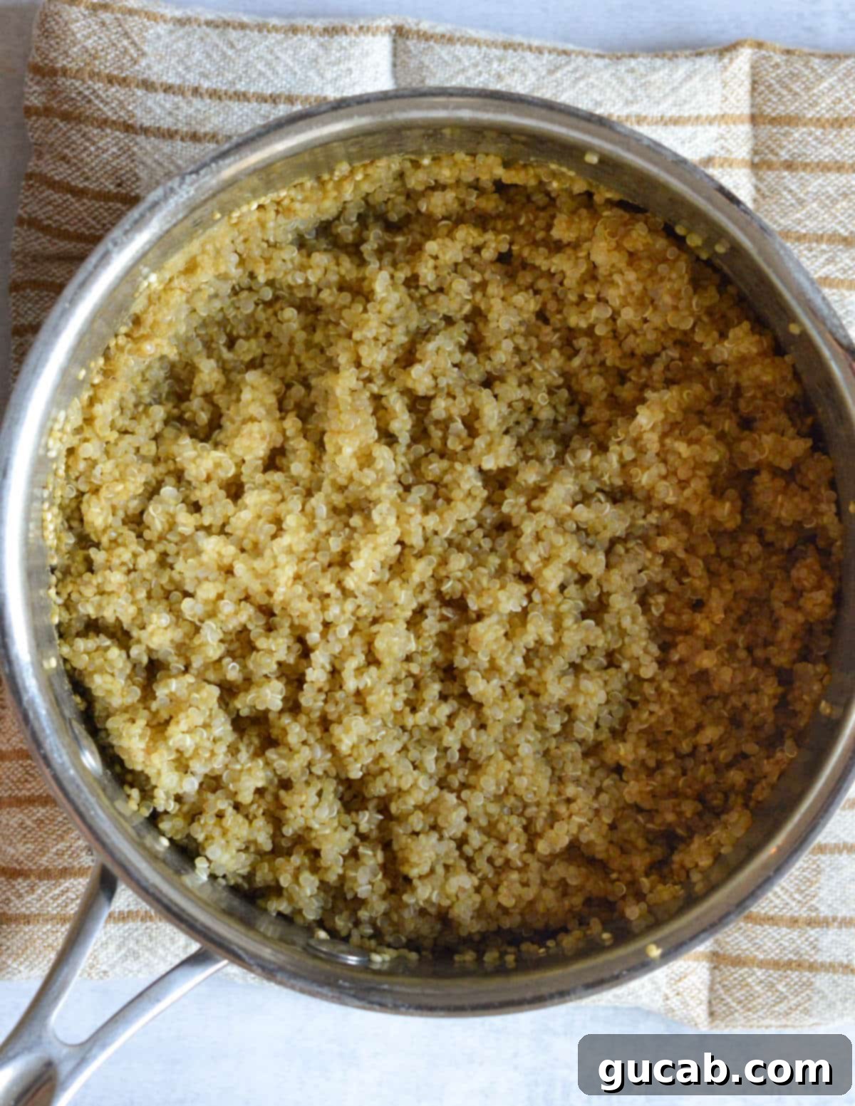 Vibrant Herb & Quinoa Power Bowl 5 a saucepan with cooked quinoa in it.