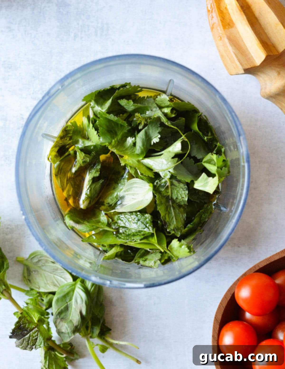 Vibrant Herb & Quinoa Power Bowl 6 herbs and olive oil in a mini food processor.