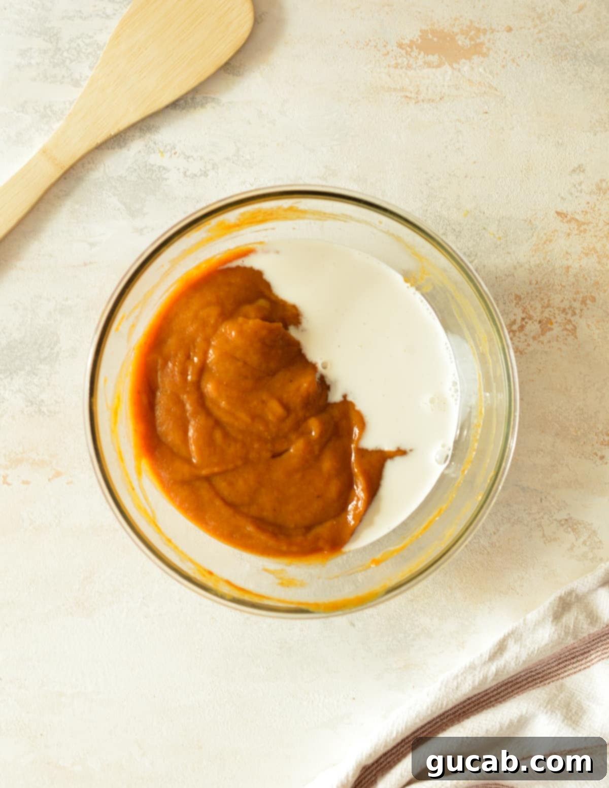 a bowl of pumpkin with half and half on it