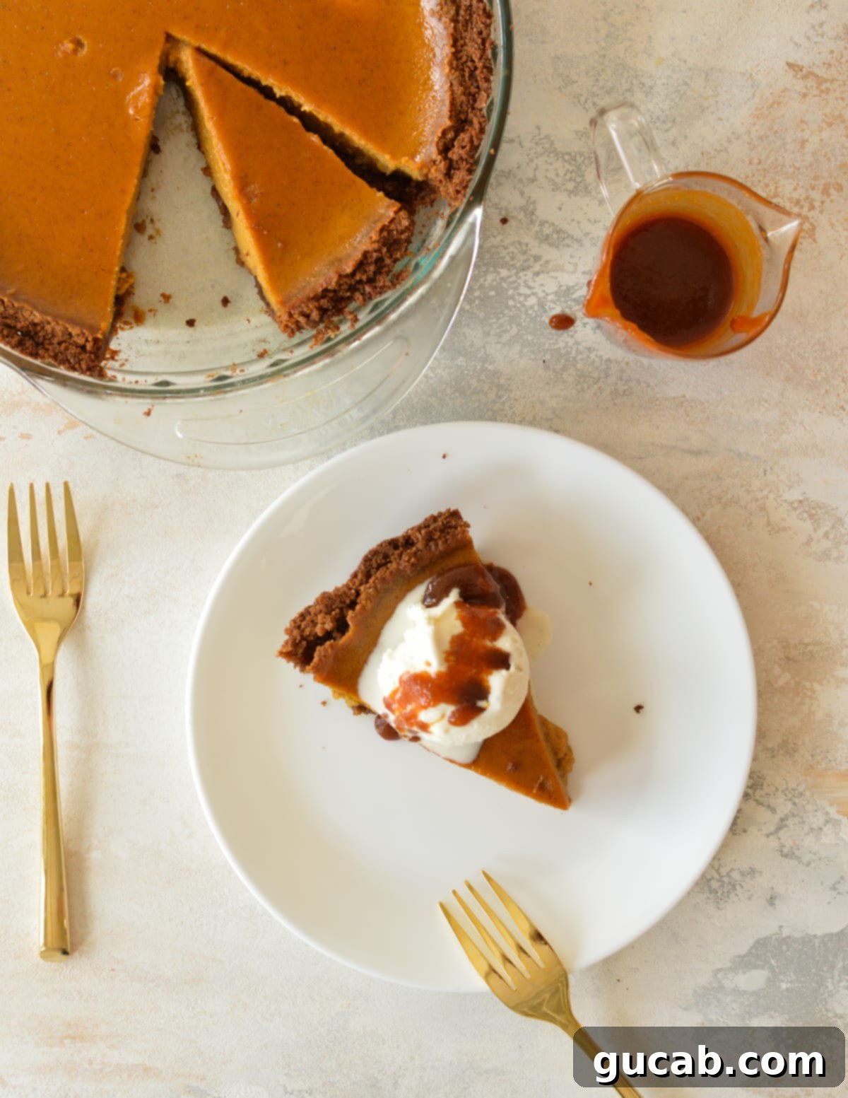 a slice of pumpkin pie with ice cream