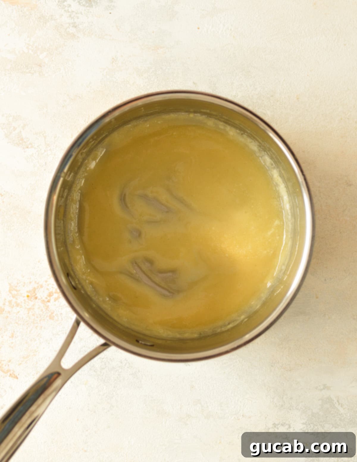 a saucepan with a light blonde gluten-free roux cooking