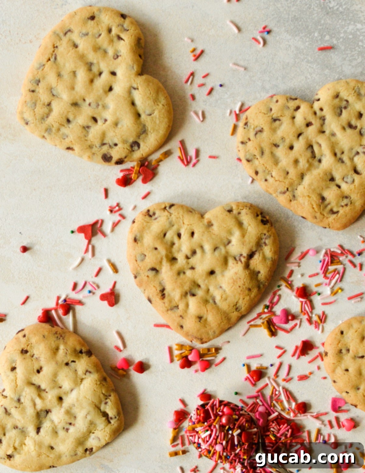 Sweetheart Chocolate Chip Delights 13 heart cookies on counter with sprinkles