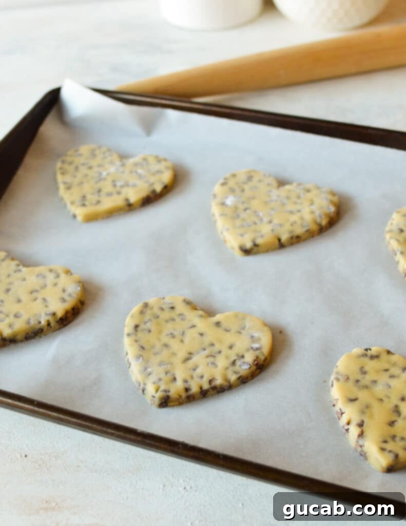 Sweetheart Chocolate Chip Delights 10 heart cookies on a sheet pan