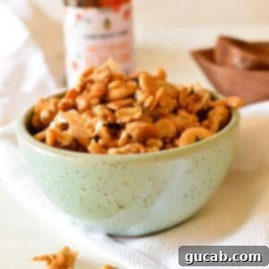 A bowl of perfectly golden and crunchy honey roasted cashews.