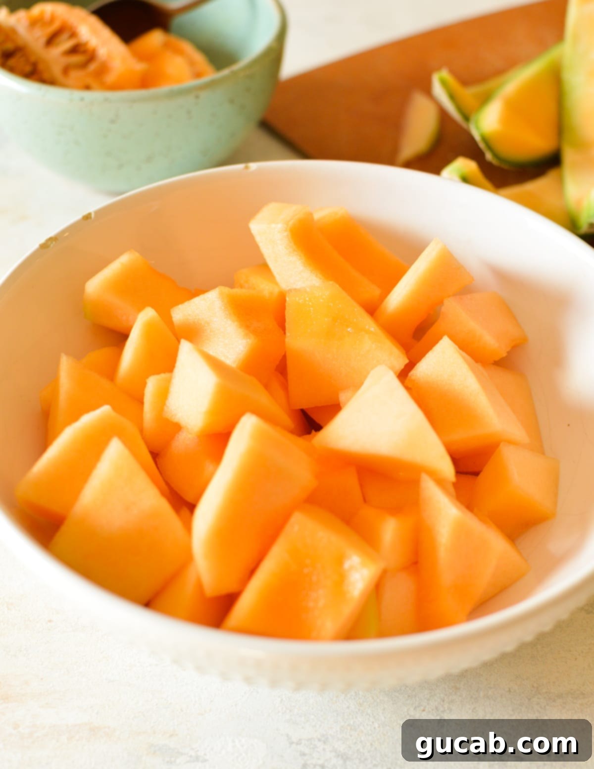 A bowl of freshly cut cantaloupe chunks