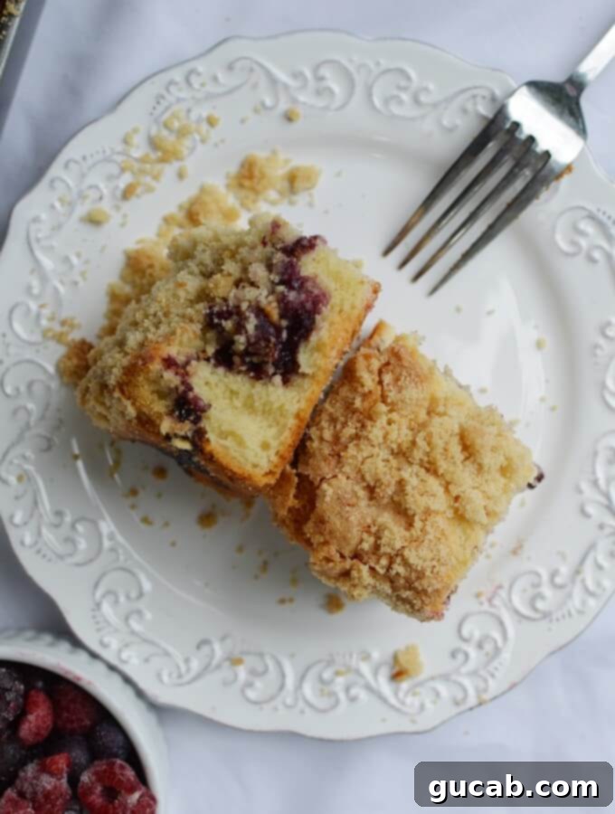 sliced gluten free coffee cake showing berry swirl