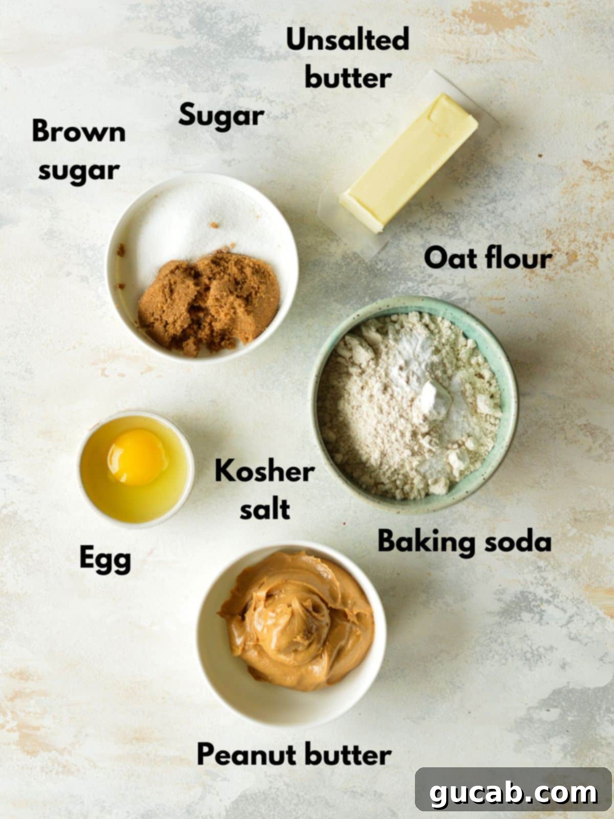 ingredients for oat flour peanut butter cookies arranged neatly on a counter