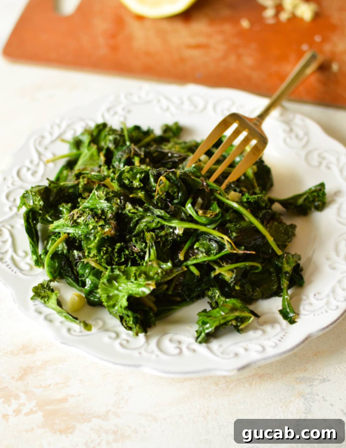 A close-up shot of a plate of vibrant sauteed spinach and kale, beautifully presented.