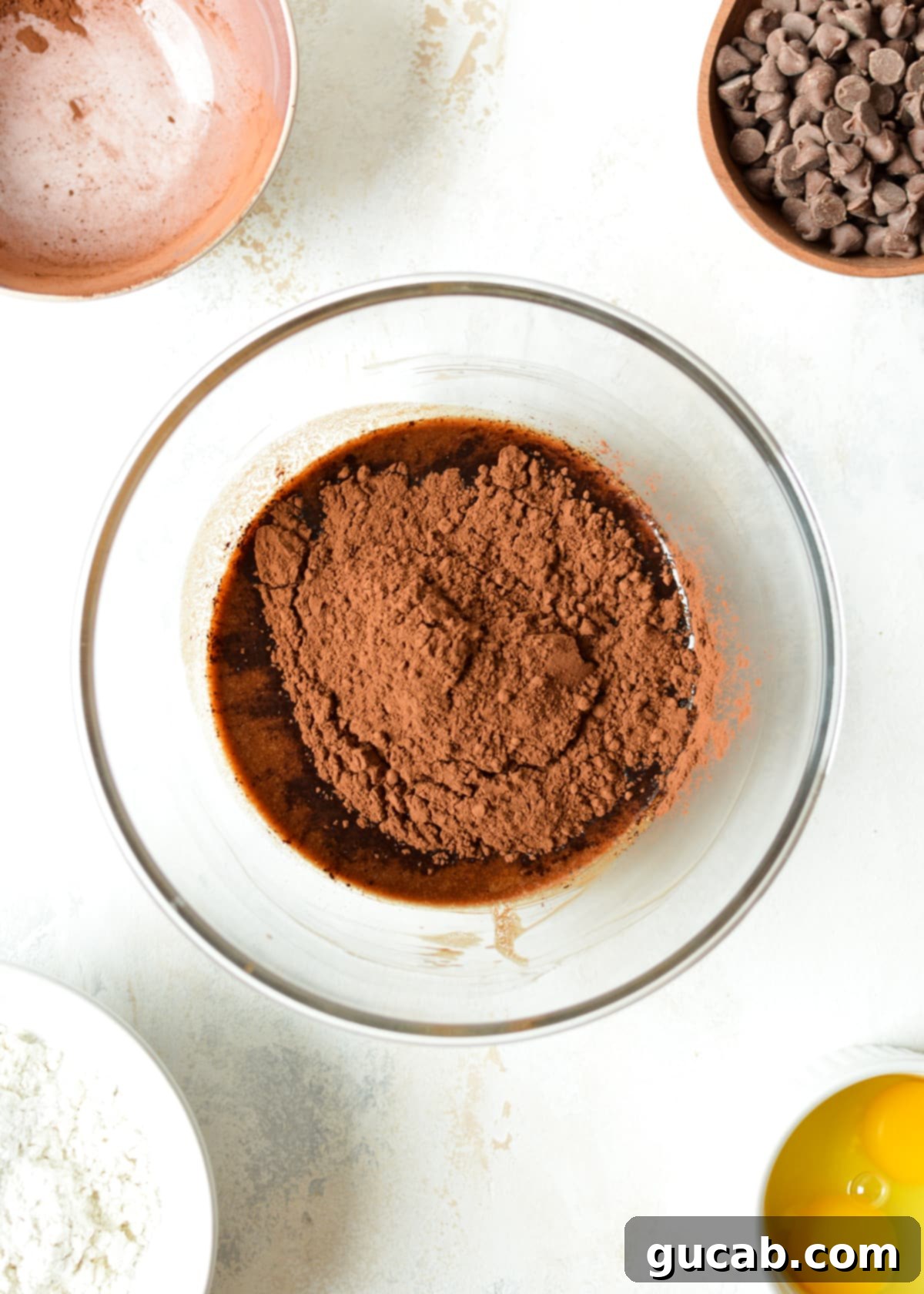 melted butter and dark chocolate with cocoa powder ready to be stirred
