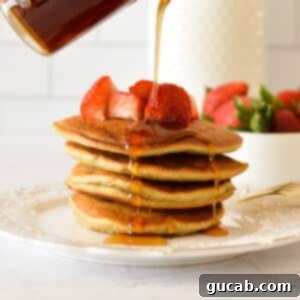 Light and Fluffy Oat Flour Pancakes 11 A stack of perfectly golden oat flour pancakes ready to be served.