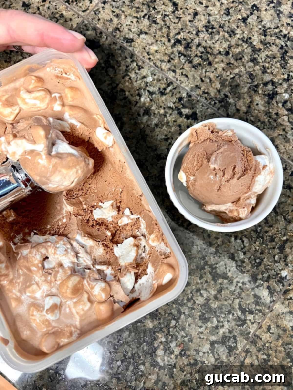 13 Nostalgic Ice Cream Maker Recipes 16 chocolate marshmallow ice cream in a container.