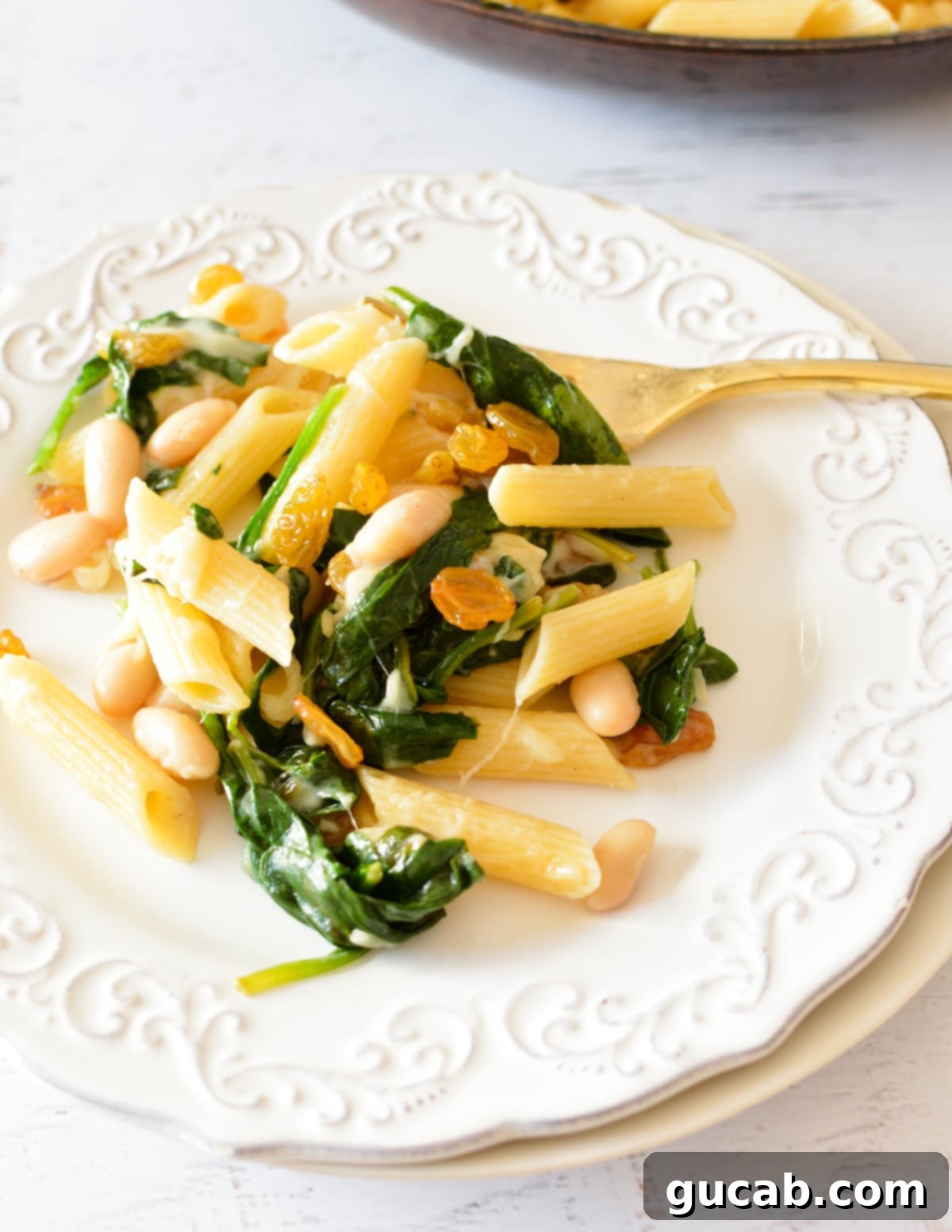 White Bean and Parmesan Spinach Pasta 7 a plate of spinach pasta with parmesan.