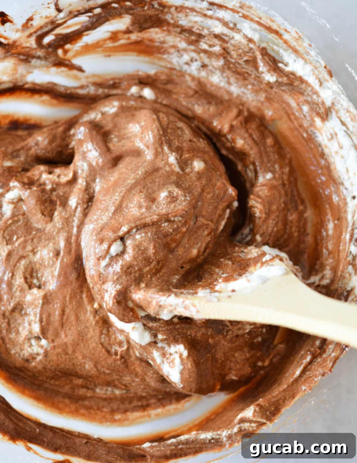 stirring chocolate mousse. 