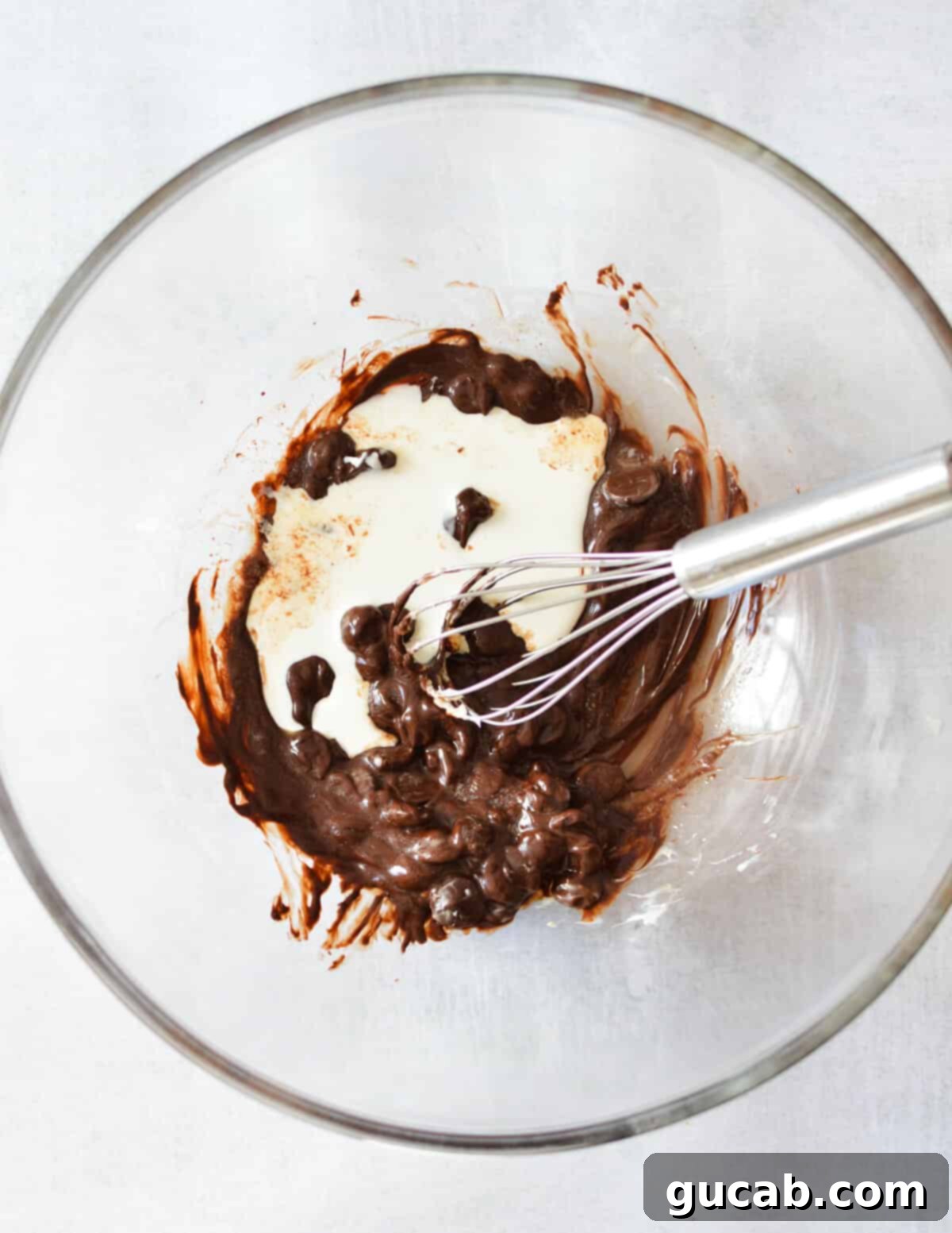 a bowl of melted chocolate and cream. 