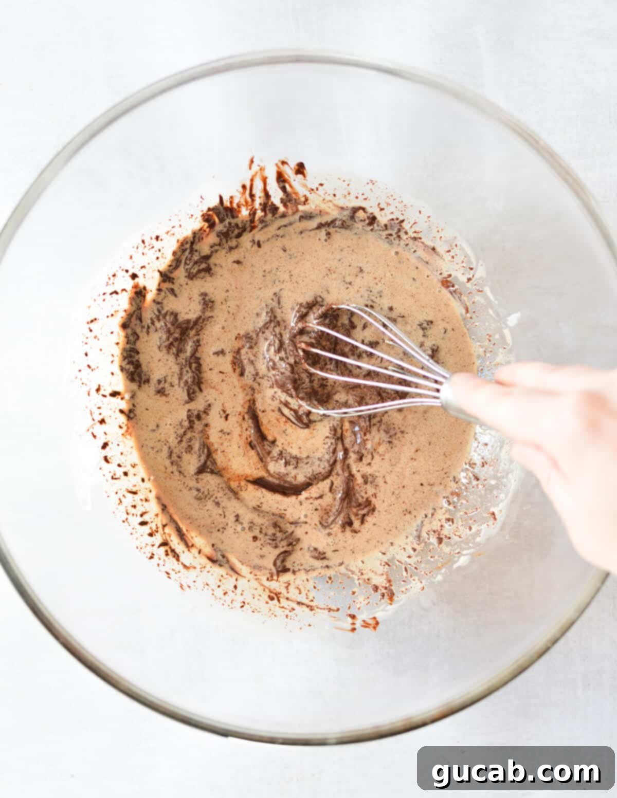 stirring chocolate and cream together. 