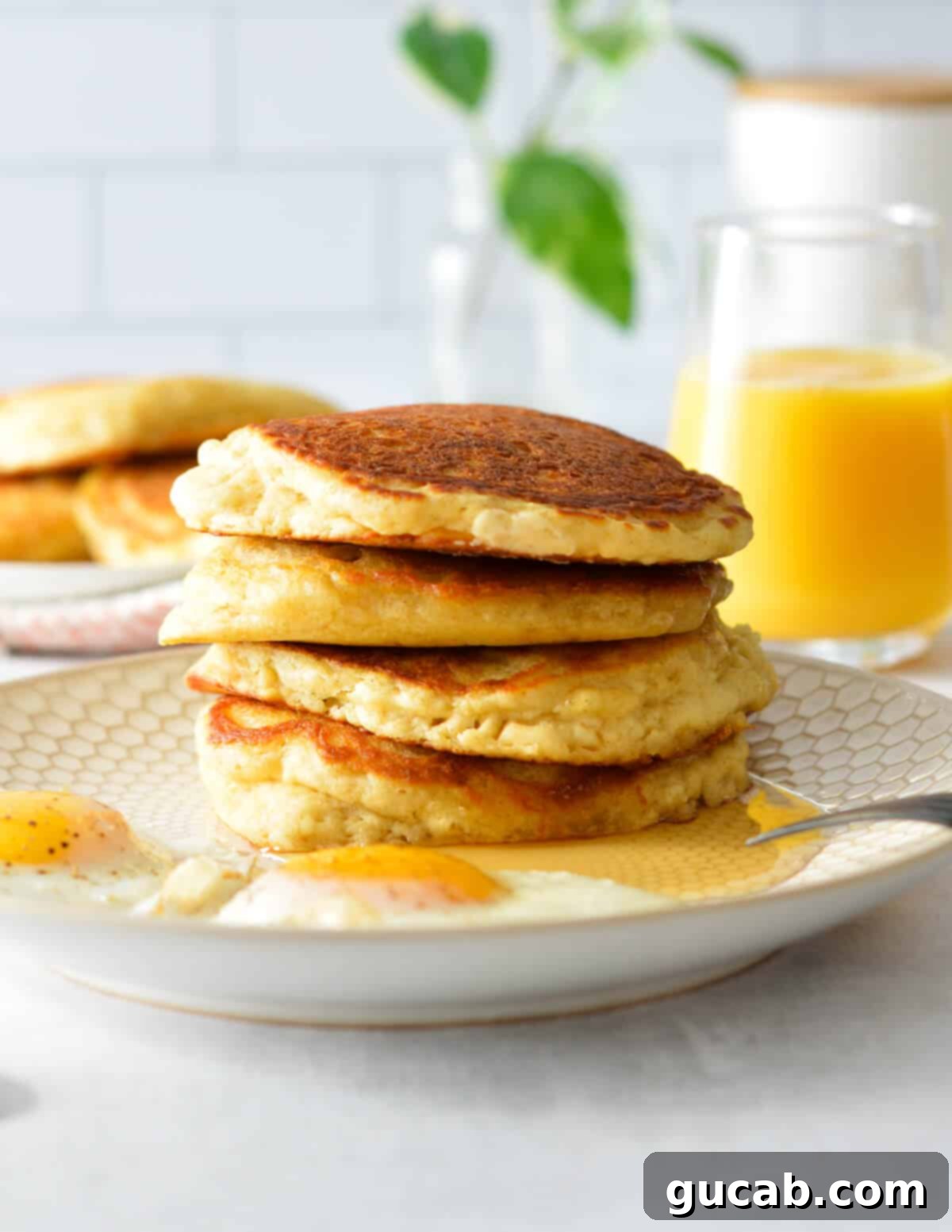 a stack of homemade buttermilk pancakes, ready to be enjoyed or frozen.
