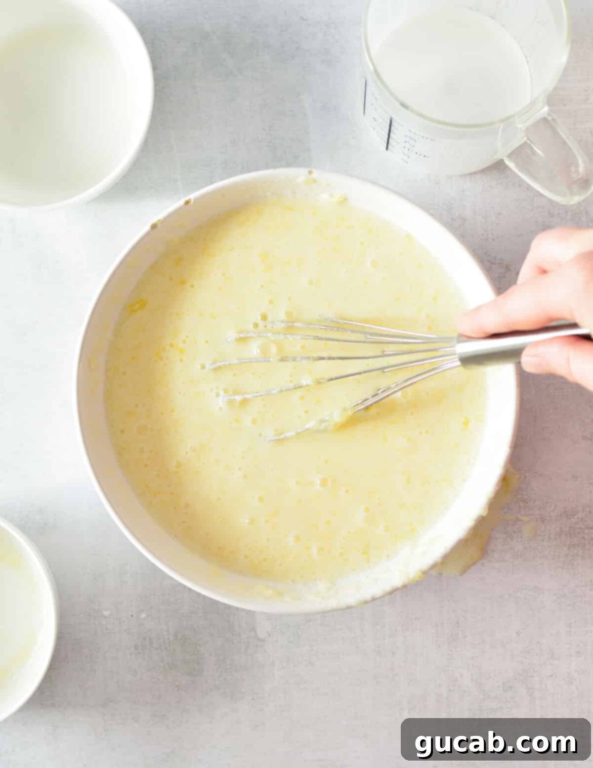 a bowl of buttermilk, eggs, and butter mixed until combined.