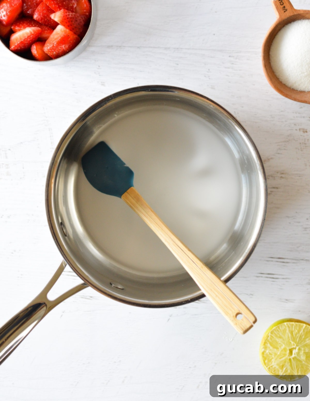 Cornstarch and water combined in a saucepan, forming a slurry.