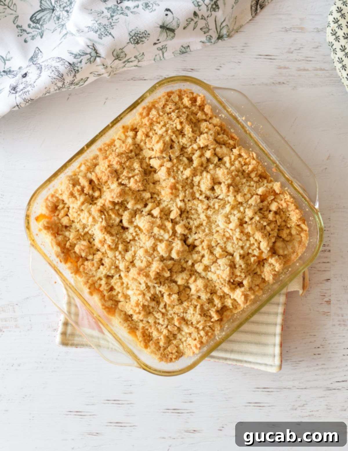 Pantry Peach Crisp Perfection 10 A perfectly baked peach crisp, golden brown on top and bubbling around the edges in a baking dish.