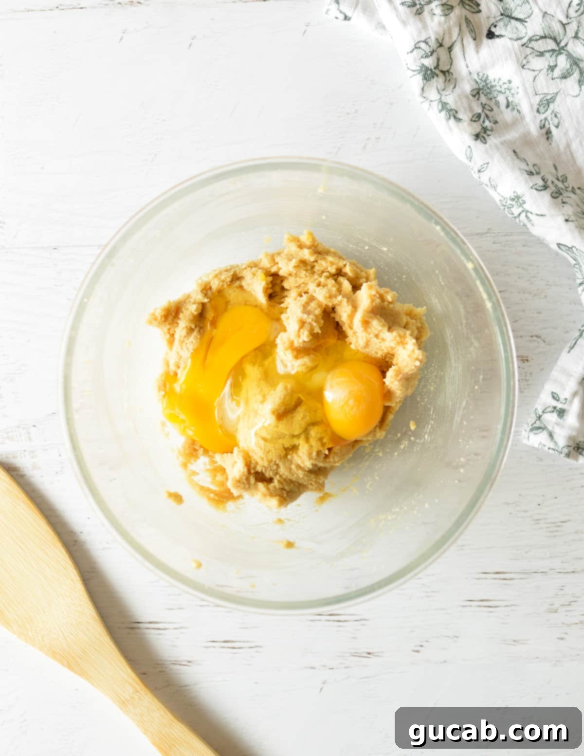 Soft and Chewy Oatmeal Bliss 6 a bowl of creamed butter and sugar with eggs on top, ready to be mixed
