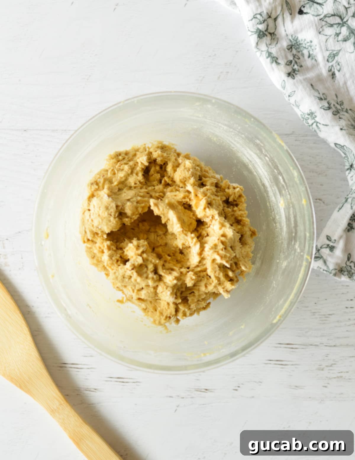 Soft and Chewy Oatmeal Bliss 9 oatmeal cookie dough in a bowl, perfectly mixed